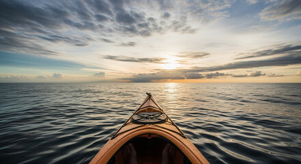POV from a kayak on the open sea, navigating toward a vibrant sunset sky.
