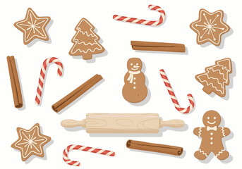 Festive assortment of gingerbread cookies, candy canes, and cinnamon sticks arranged on white background.