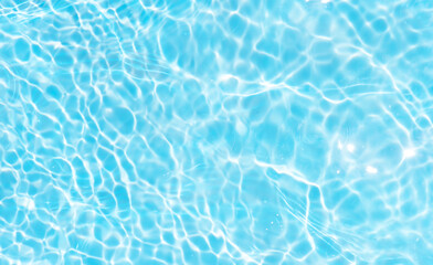 Blue water with ripples on the surface. Defocus blurred transparent blue colored clear calm water...