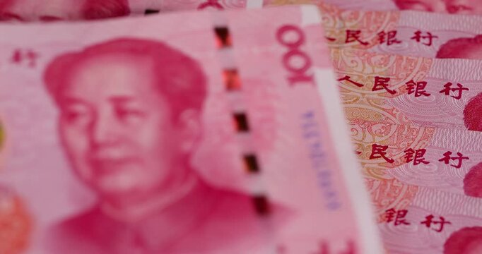 Chinese money of one hundred yuan closeup, the obverse of genuine Chinese yuan money stacked on top of each other