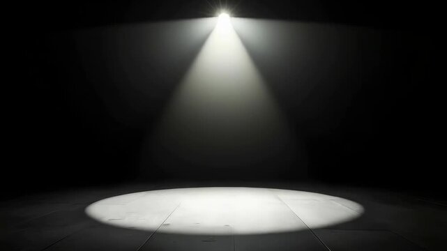Dramatic Spotlight Beam Illuminates Empty Stage Floor with Subtle Texture in Dark Studio Environment