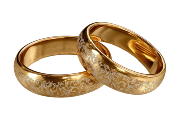 Golden wedding rings with delicate floral engraving