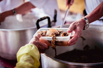 volunteers give food to local poor people, Feeding the poor Help them relieve hunger