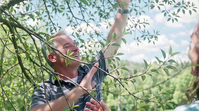 man stretching outdoors, breathing deeply, finding peace and balance in nature's embrace | wellness, meditation, fitness, lifestyle, mindfulness theme