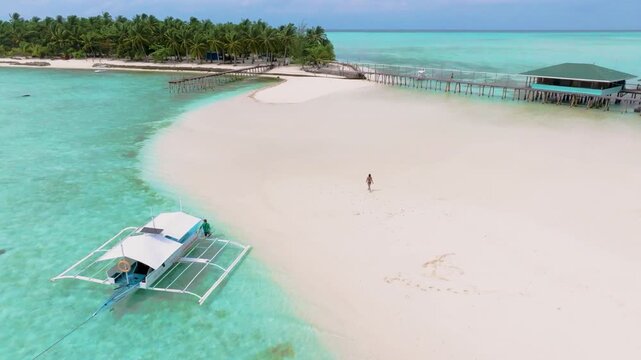 4K Aerial VIew OfTropical Vacation on Onok Island, Philippines. People Walking on Sandbar.
the shallow, clear turquoise water and the complete tropical vacation experience.
