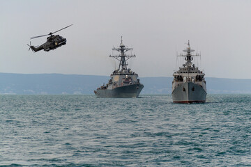 A group of patrol warships accompanied by a helicopter are carrying out a peacekeeping mission in the Black Sea.  © ValStock