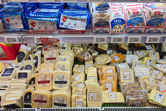 Kuala Lumpur, Malaysia &ndash; Sep 14, 2025: A refrigerated cheese section inside Jaya Grocer showcasing a wide assortment of cheeses, including Belcube, Dodoni feta, halloumi and artisanal blocks.