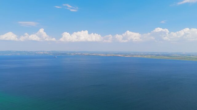Seddulbahir, Eceabat, Turkey. Panoramic aerial view of Cape Helles with Dardanelles Strait, Aegean Sea, and ships navigating the waterway on clear sunny day. Aerial View, MasterShots, Panorama