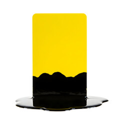 Yellow rectangular object partially submerged in black liquid.