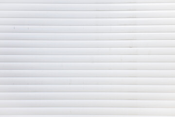 Obraz premium Close-up Texture of White Rolling Shutter Door or Window Blinds