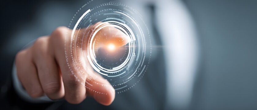 Human finger presses on a holographic interface with glowing center, showcasing modern technology and digital innovation with futuristic visual effects, set in a business context.