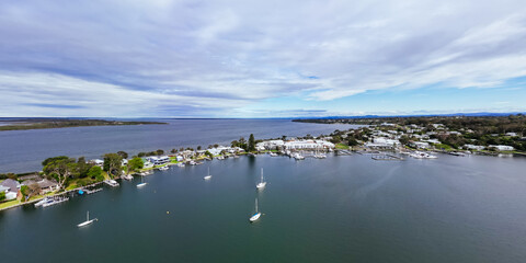 METUNG, AUSTRALIA - SEPTEMBER 21 2025: Aerial views around Metung Wharf on a warm sunny spring day i