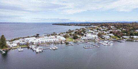 METUNG, AUSTRALIA - SEPTEMBER 21 2025: Aerial views around Metung Wharf on a warm spring day