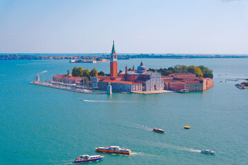 San Giorgio Maggiore Island with turquoise lagoon in Venice, Italy. Aerial view 
