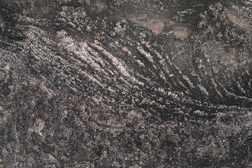 Ancient dark rock stone terrain background with natural wave texture