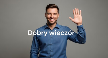 A smiling man in a blue shirt waving his hand against a plain gray background with the words Dobry wieczór displayed in the center
