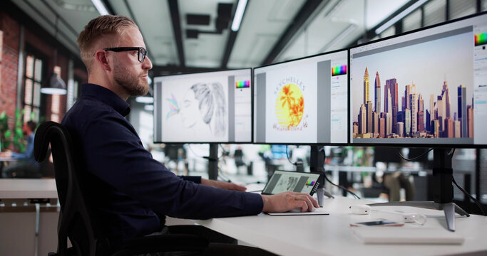 Young Caucasian Man Creating Graphic Design On Computer Screen