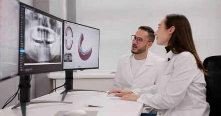 Female Dentist Using 3D Technology For Oral Imaging