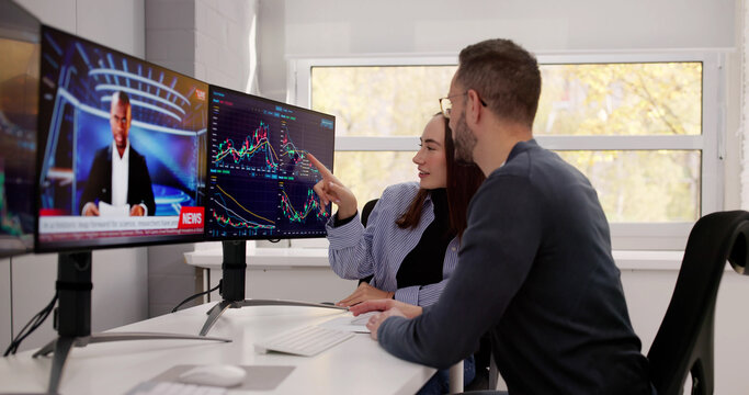 Professional Man And Woman Trading Shares Online