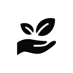 Hand holding two green leaves