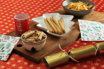 Christmas themed dishes on Christmas Table cloth