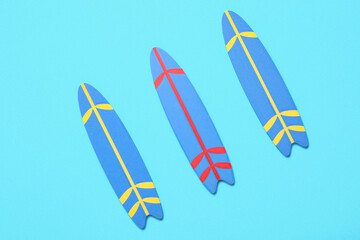 Mini surfboards on blue background