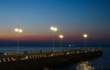 Vladivostok in the evening. Embankment at sunset.
