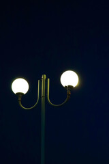 Lamp post. Night illumination. City at night.