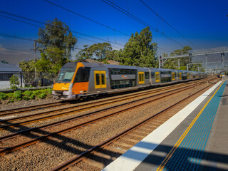 Obraz premium Passenger Train going through Summer Hill train station a suburban Sydney train Station NSW Australia