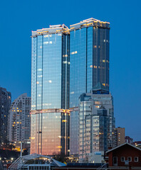 Vladivostok at night. Modern buildings. Recreation and tourism in Russia.