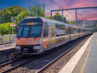 Obraz premium Passenger Train going through Summer Hill train station a suburban Sydney train Station NSW Australia