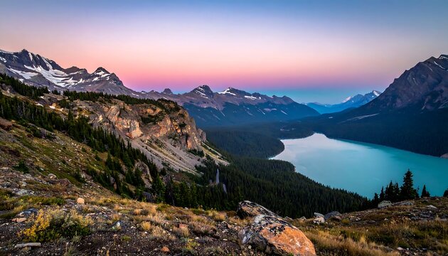 A breathtaking landscape photo captures a panoramic view of a serene lake surrounded by majestic mountains. The sky is ablaze with pastel hues