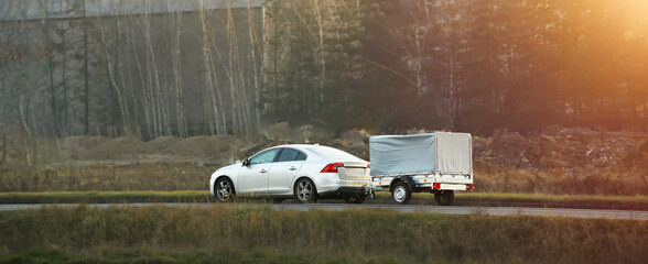 Passenger vehicle towing trailer for summer trip