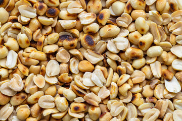 Close-up macro of roasted peanut texture,Close-Up of Shiny Roasted Peanuts Showing Texture and Perfect Crispness.