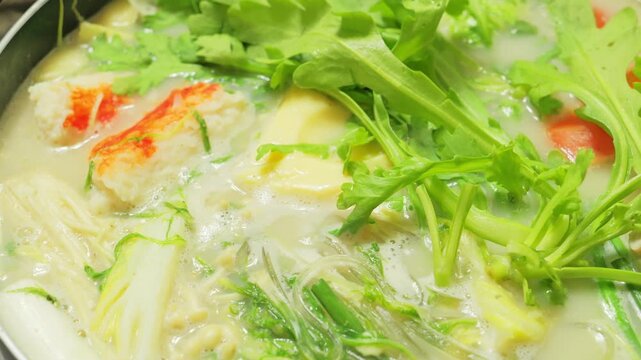 Hot pot dishes featuring plenty of chicken, white fish, vegetables, and more—warm winter fare