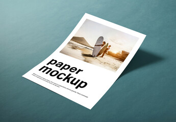 Angled Paper Mockup on Teal Surface with Natural Shadow