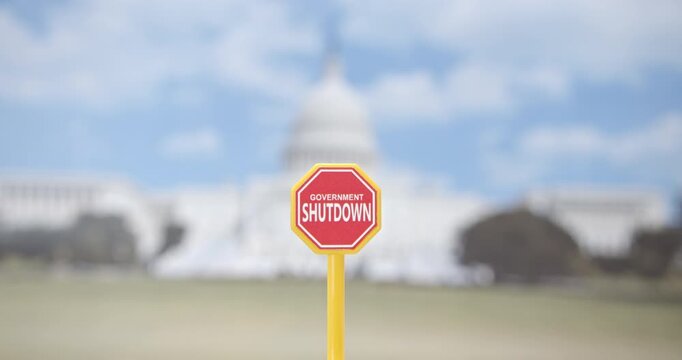 Close-up of red &ldquo;Government Shutdown&rdquo; board at the U.S. Capitol. Symbol of budget freeze, federal service stoppage, political gridlock and looming economic damage after global leadership talks.
