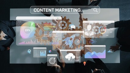 A team of business professionals collaborates on a content marketing strategy, utilizing digital analytics displayed on a transparent touchscreen over a conference table. Raster