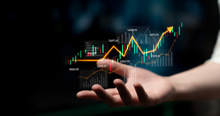 A creative representation of financial growth, featuring a hand holding digital graphs showcasing positive trends and market data for modern business finance. Scalp