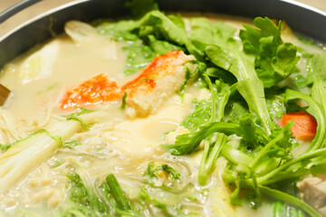 Hot pot dishes featuring plenty of chicken, white fish, vegetables, and more—warm winter fare