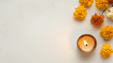 Diwali celebration with a candle amidst marigold flowers. The soft glow of the candle complements the warm hues of the flowers, creating a peaceful atmosphere.