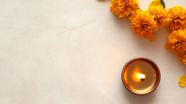 Celebratory arrangement with a glowing diya lamp and vibrant marigold flowers, casting a warm, festive ambiance. The composition suggests a cultural celebration.