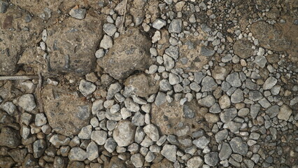 Close-up texture of rocky ground with stones and dirt