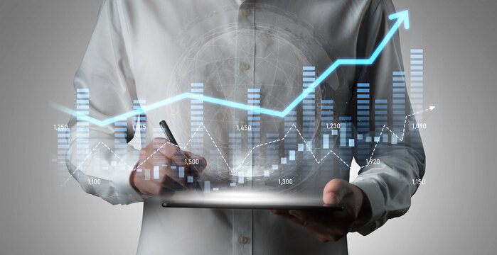 A business professional engages with digital financial data, analyzing trends and growth patterns on a tablet in a sleek modern office, showcasing expertise in analytics. Scalp