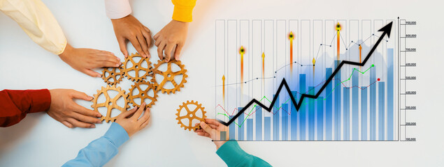 Diverse hands join together with gears alongside a growth chart, representing collaboration,...