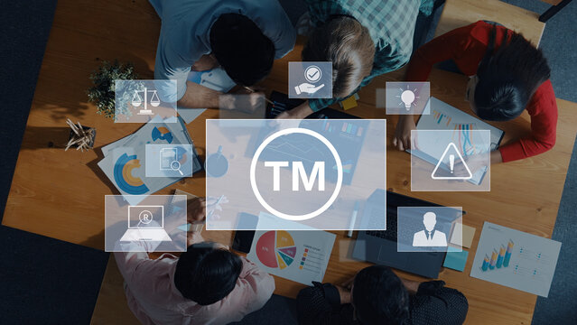 A diverse team collaborates in an office, analyzing charts and data on laptops. The scene captures the essence of teamwork and strategic planning for business growth. Trope