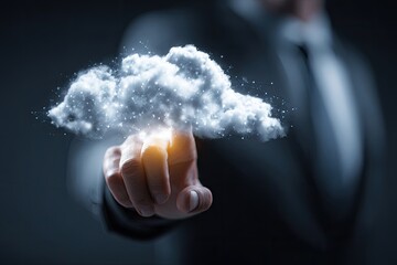 A businessman points at a glowing cloud with a fingertip, representing technology and data storage