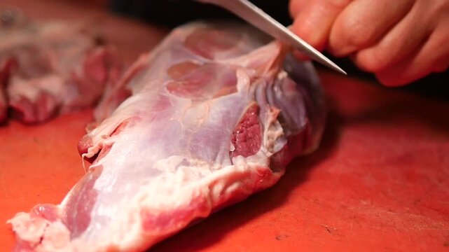 Preparing fresh meat at a local market stall - Powered by Adobe