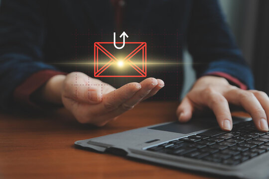 Smishing attack, sms spam phishing from scammer, concept. Red envelope with hook icon in criminal hacker hand who use mobile smart phone cyberattack sending scam malware spreading virus text message.