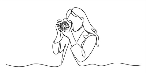 Minimalist continuous line drawing of a woman holding a camera, capturing life's moments, symbolizing artistic expression and a photography hobby.